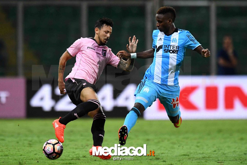 PALERMO, ITALY - AUGUST 06:  Accursio Bentivegna (L) of Palermo and Bouna Sarr of Olympique Marseille compete for the ball on during the friendly match between US Citta' di Palermo and Olympique Marseille at Renzo Barbera Stadium on August 6, 2016 in Pale