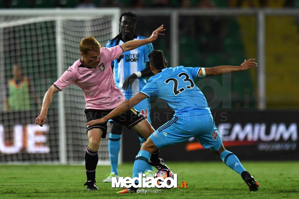 PALERMO, ITALY - AUGUST 06:  Alessandro Gazzi (L) of Palermo and Zinedine Machach of Olympique Marseille compete for the ball on during the friendly match between US Citta' di Palermo and Olympique Marseille at Renzo Barbera Stadium on August 6, 2016 in P