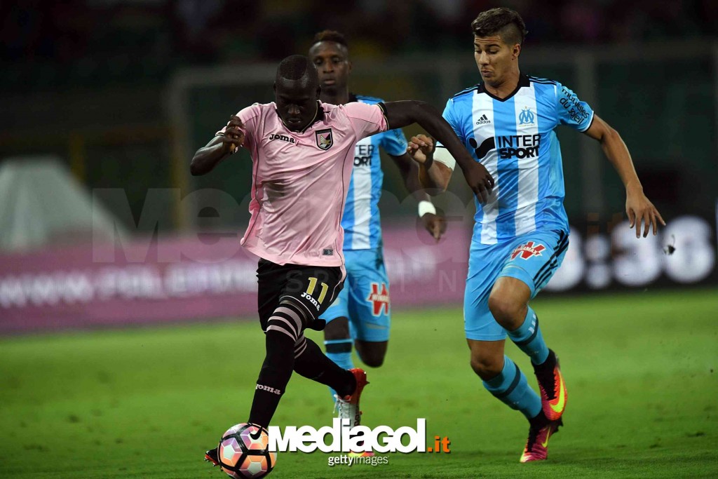 PALERMO, ITALY - AUGUST 06:  Carlos Embalo (L) of Palermo hilds off the challenge from Zinedine Machach of Olympique Marseille during the friendly match between US Citta' di Palermo and Olympique Marseille at Renzo Barbera Stadium on August 6, 2016 in Pal